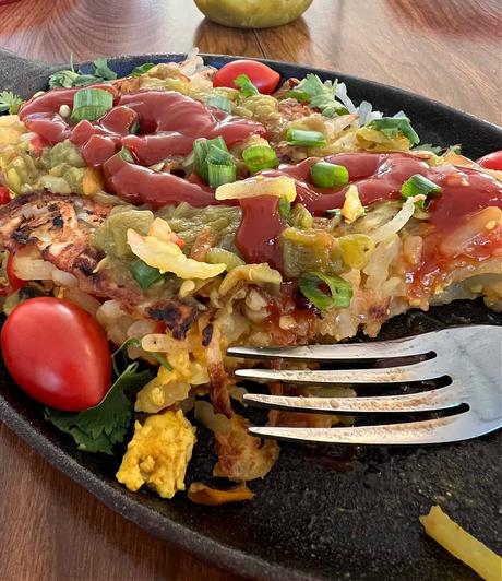 skillet with vegan hash brown and vegan tofu eggs