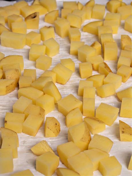 baking tray with cubed Yukon gold potatoes