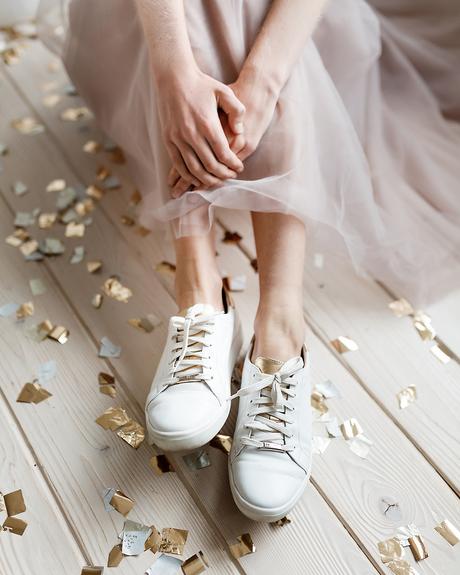 non traditional wedding shoes sneakers white with gold shutterstock