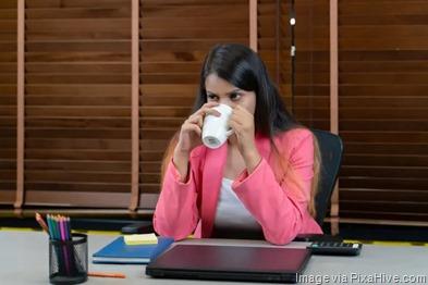 Stressed-employee-drinking-coffee