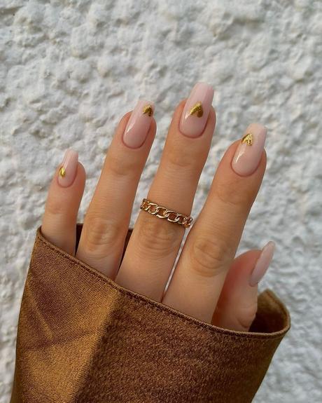 simple wedding nails nude with gold hearts charsgelnails_