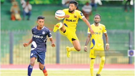 Action from the match between Saunders SC and Police SC.