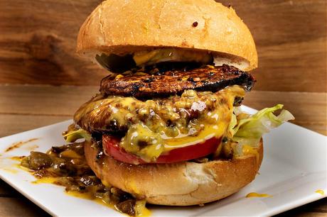fully dressed green Chile portobello cheeseburger with Hatch Green Chile and vegan cheese sauce