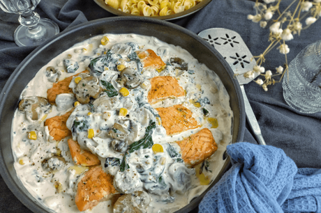 Baked salmon in cream-mushroom-spinach sauce