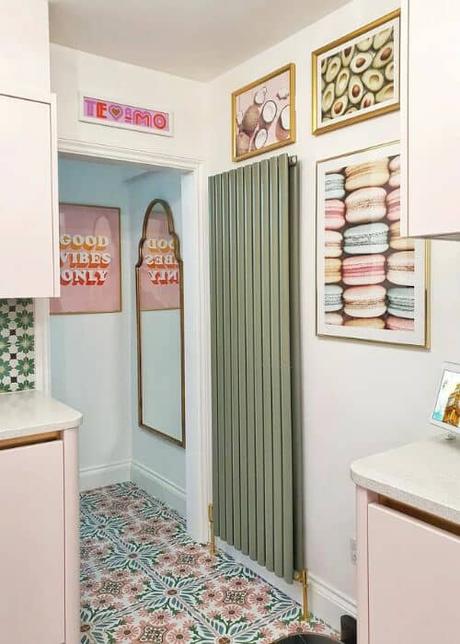 sage green radiator in a colourful kitchen