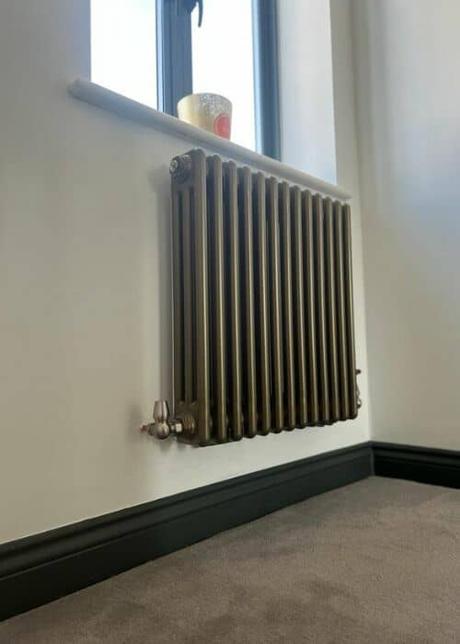 milano windsor bronze column radiators on a wall