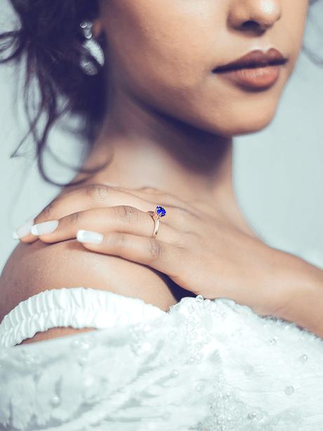 A Bride Wearing a Sapphire Engagement Ring
