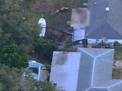 Sinkhole Swallows Boat, Part Of House In Florida (Video)