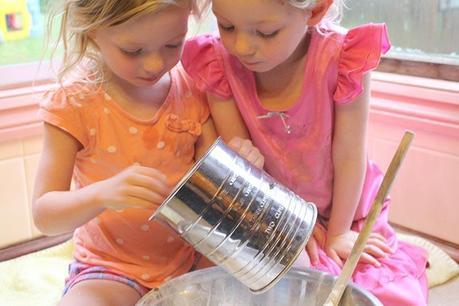 The girls sifting flour