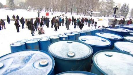 Protesters in Edmonton built a wall of 116 oil barrels across the legislature steps