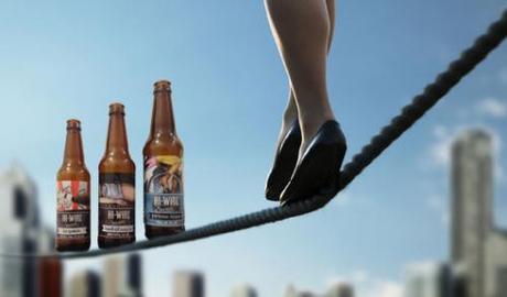 Woman walking on tightrope over cityscape, low section