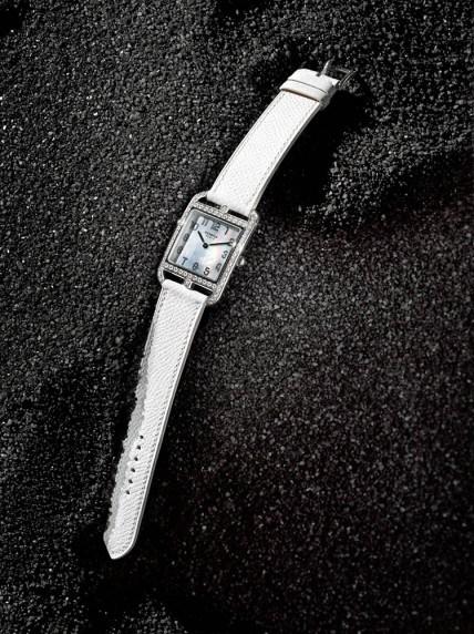 Hermès  “Cape Cod” stainless steel and diamond watch with white calfskin strap. Quartz. Switzerland. $14,850.