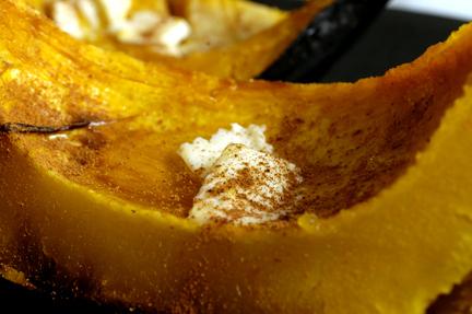 Roasted Acorn Squash wedge with butter, maple syrup, and cinnamon