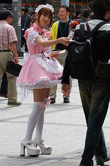A maid distributing flyers (image from wikipedia entry on Maid café)