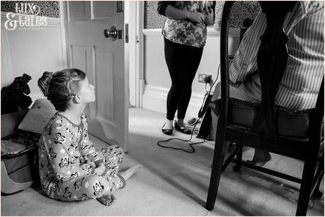 Little girl watches as mother gets ready for vintage 1950s themed wedding