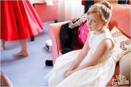 Bridesmaids makes an exasperated face at vintage themed wedding