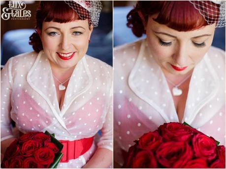 Bride in 1950s themed wedding with read heart details in a couture company wedding dress