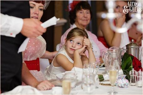 Little girl looks at father giving grooms speech yorkshire wedding 