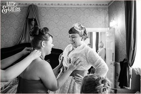 Bridesmaid grabs brides boobs being funny and joking at vintage themed wedding 