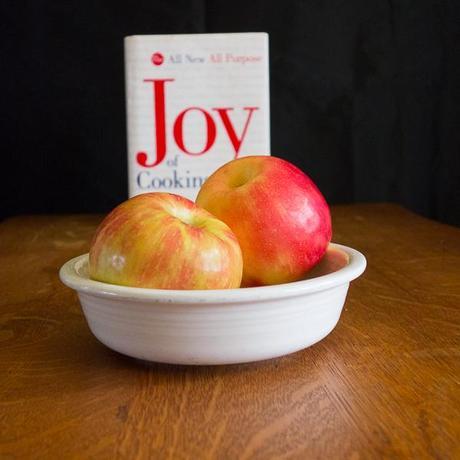 Photo of two apples with the Joy of Cooking cookbook