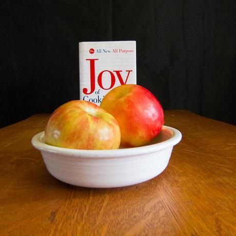 photo of two apples with The Joy of Cooking cookbook