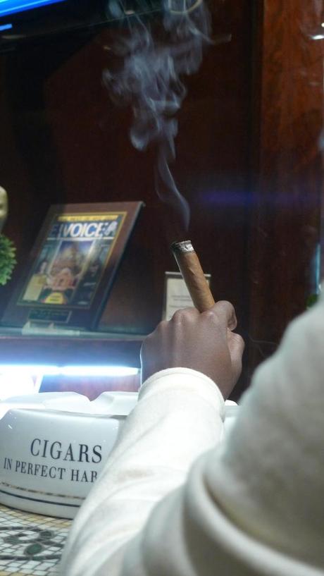 Young Lady smoking a Cigar for the first time at De La Concha Tobacconist, New York, NY / Leica D-Lux 4