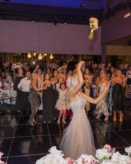 Real Weddings: Tayler & Jayden real wedding tayler and jayden throws bouquet