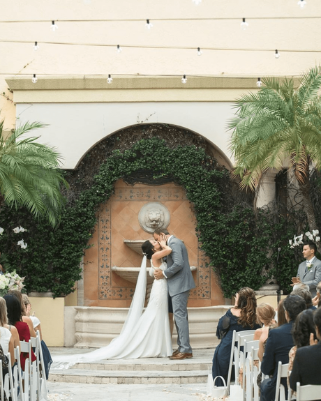best wedding venues in newlyweds kissing at the ceremony