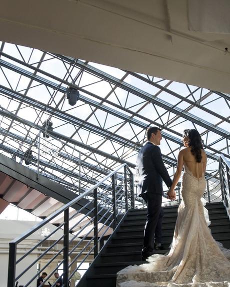 best wedding venues in new york newlyweds standing on the stairs