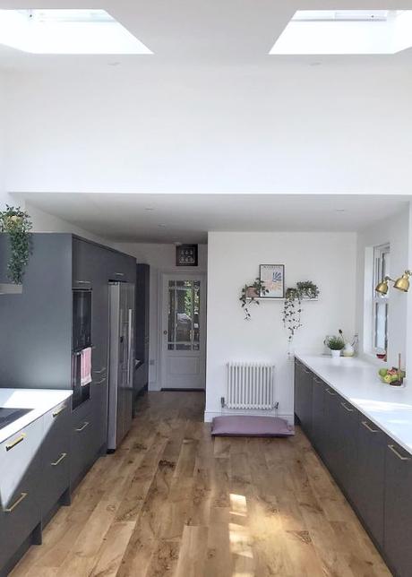 small white column radiator in a kitchen