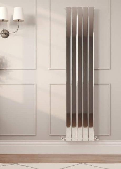 chrome vertical radiator on a panel wall