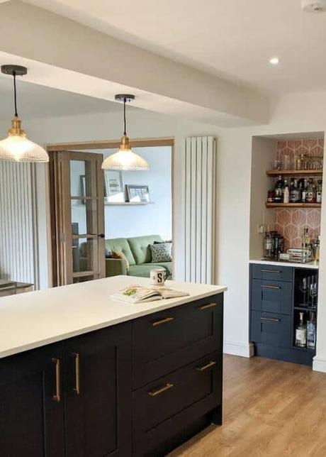 two white vertical radiators in a kitchen