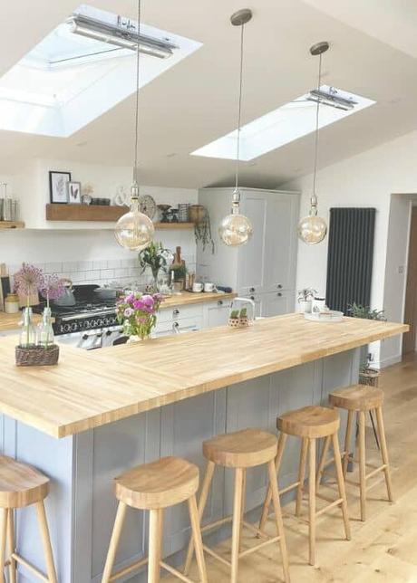 vertical anthracite column radiator in a white kitchen