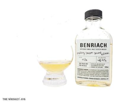 White background tasting shot with the Benriach Malting Season 2nd Edition sample bottle and a glass of whiskey next to it.