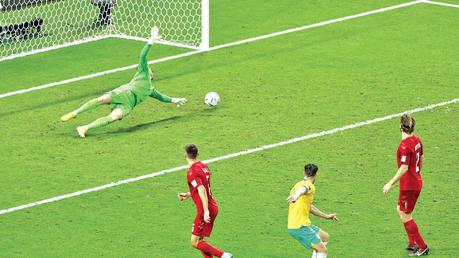 Australia’s Mathew Leckie scores their first goal