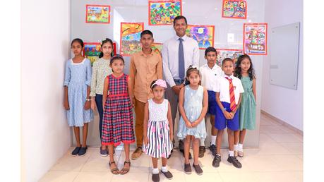 Rajeev Rajapakse- Managing Director, Eric Rajapakse Opticians with the winners of the art competition.