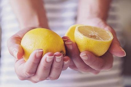 Woman holding lemon