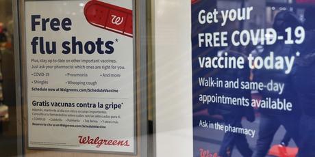 Flu and coronavirus (COVID-19) vaccine signage is seen at a Duane Reade by on Broadway on Jan. 5, 2023, in New York City. 