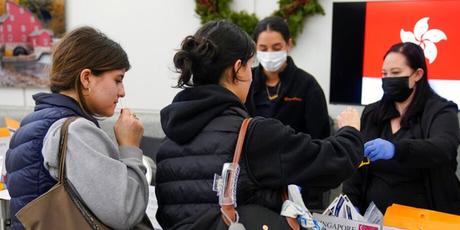 Passengers disembarking from international flights take anonymous COVID tests for study purposes at Newark Liberty International Airport in Newark, N.J., Wednesday, Jan. 4, 2023. 