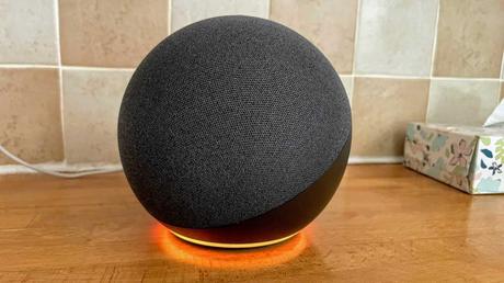 Amazon Echo 4 with orange LED ring on kitchen counter