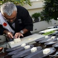 Chef Dharshan Munidasa plating up Tofu & Asparagus goma ae