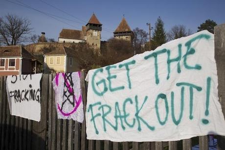 anti frack banner and ancient church