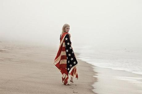 Girl-on-the-Beach-with-American-Flag-Cape-photographed-by-Lauren-Ward