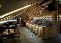 Bar in the attic of an old house by Inblum Architects