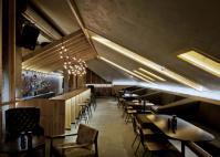 Bar in the attic of an old house by Inblum Architects