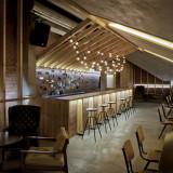 Bar in the attic of an old house by Inblum Architects