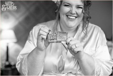 Bride holds up lottery ticket at York wedding