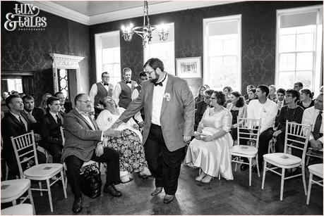 Groom holds mothers hand at Grays Court Wedding