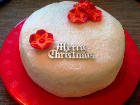 merry christmas alternative with a twist tropical fruit cake with rum and ginger coconut icing and flower decoration recipe and easy method