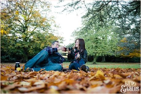 autumn picnic engagement shoot with orange leaves 